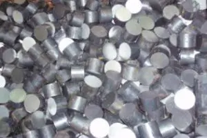 Metallic cylindrical pieces scattered closely together.